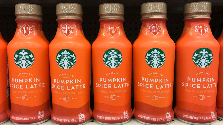 Row of Starbucks Pumpkin Spice Latte bottles at grocery store