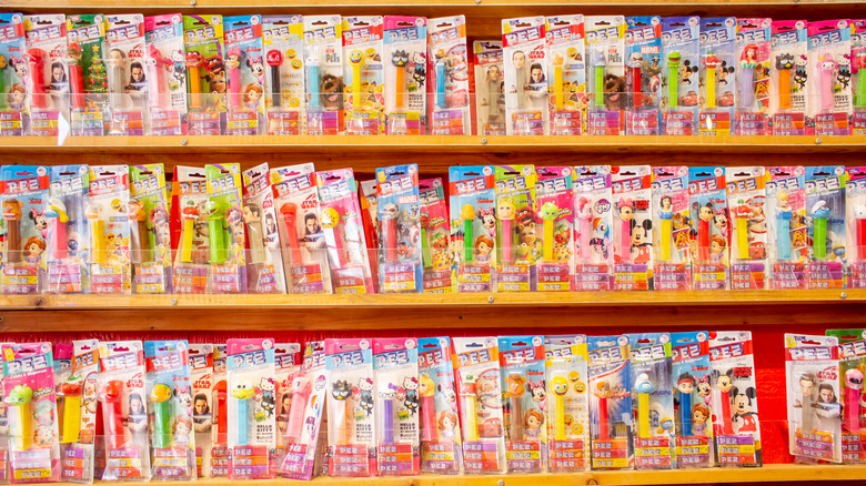 Shelves lined with various PEZ dispensers in their packages