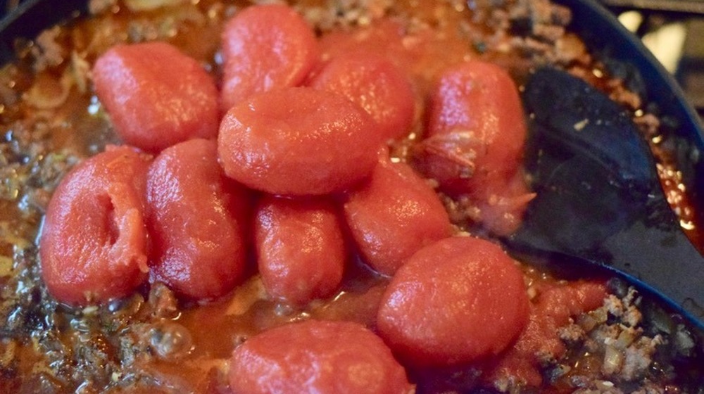 lamb and tomato sauce cooking for moussaka recipe