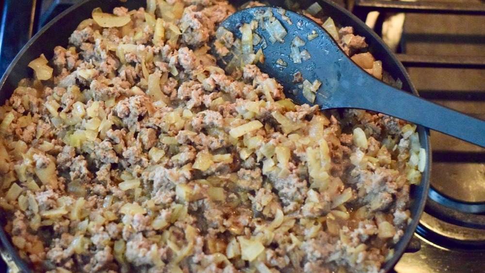 lamb meat sauce cooking for moussaka recipe