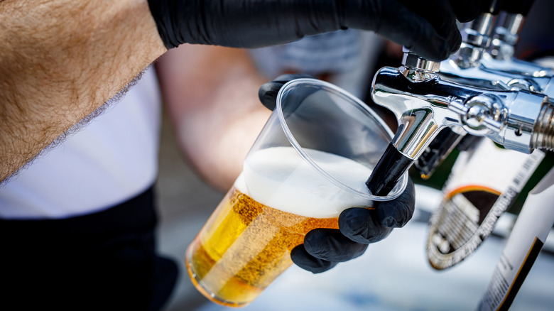 pouring beer in stadium 