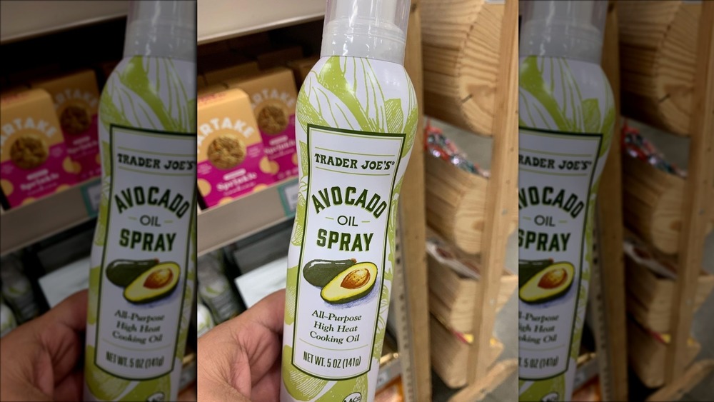 Hand holding Trader Joe's Avocado Oil Spray