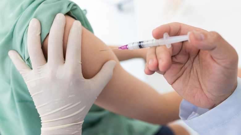 Doctor administering vaccine