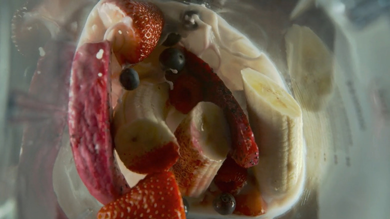 fruit being blended inside blender