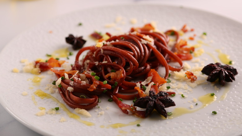 plate of linguine cooked in red wine