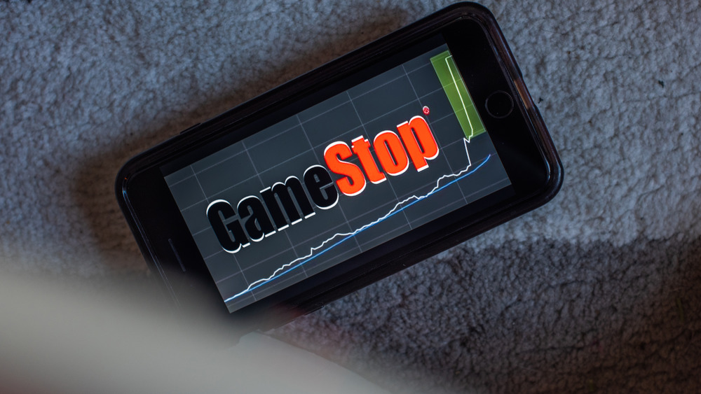 GameStop logo with stock chart