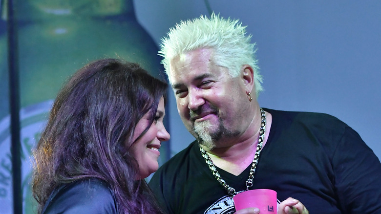 Rachael Ray and Guy Fieri on stage 