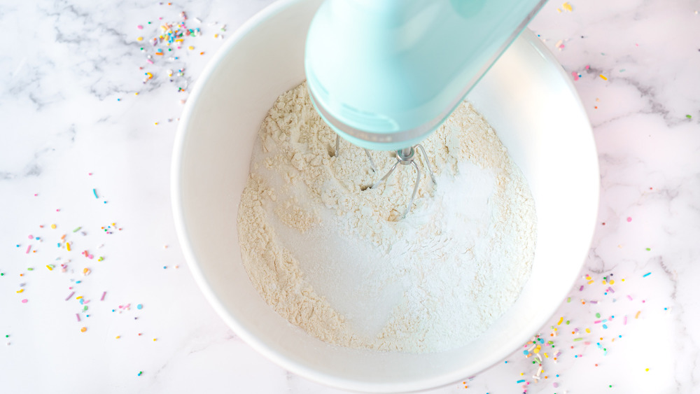 mixing dry ingredients for rainbow cake