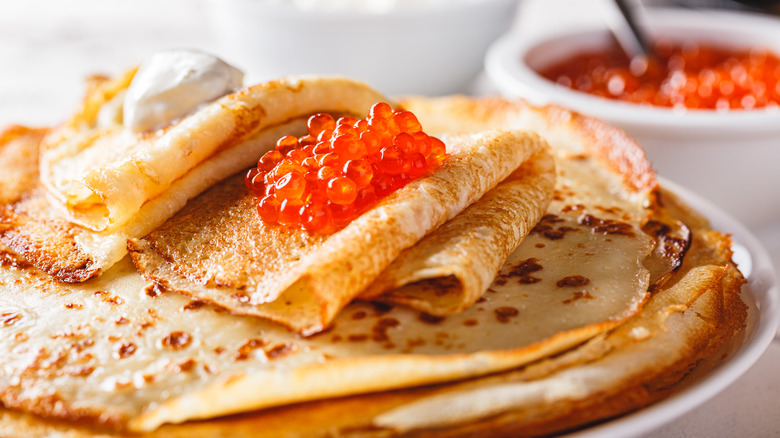 blini topped with caviar