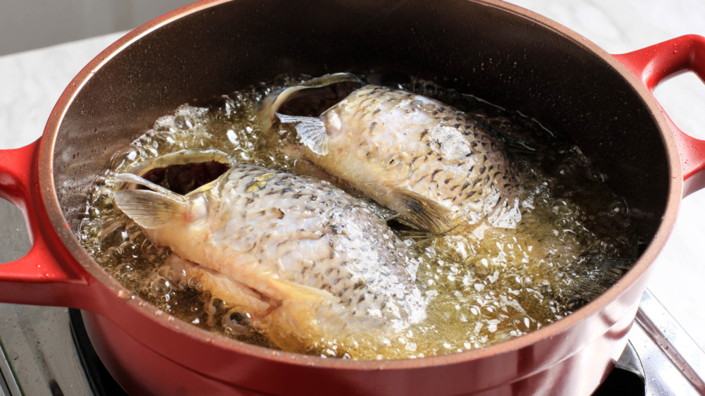 Fish frying in pan