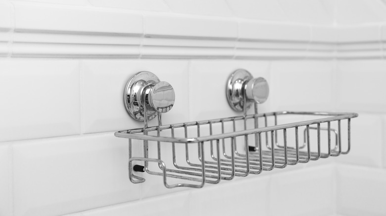 Shower caddy suctioned to shower wall