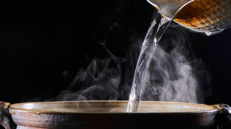 Boiling water poured into pot