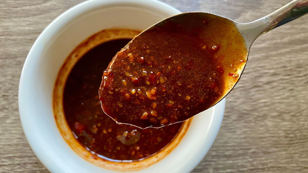 Sauce on a spoon and in a bowl