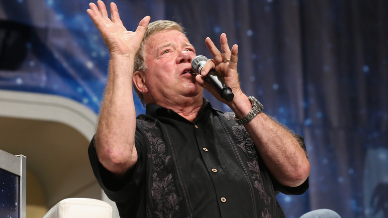 William Shatner sitting and talking