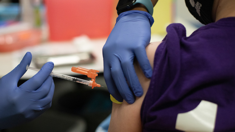 Young person gets Covid-19 vaccine