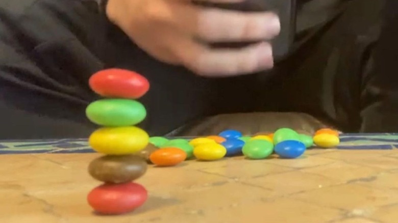 Man makes Guinness World Record after building tallest stack of M&M's