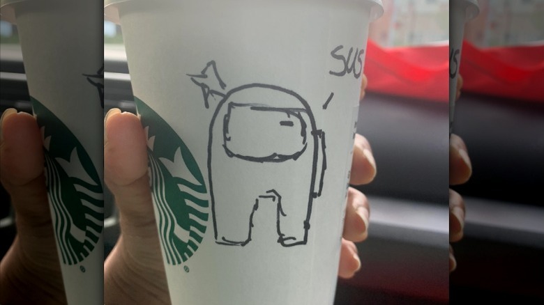 "Among Us" drawing on Starbucks cup