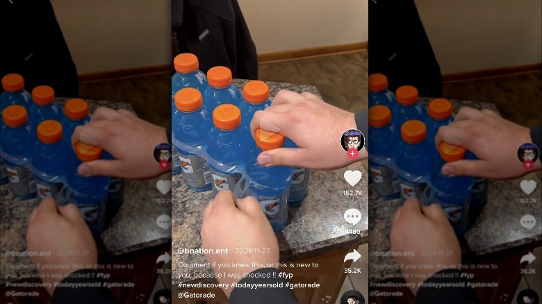 Screenshot of a person grabbing bottle of Gatorade