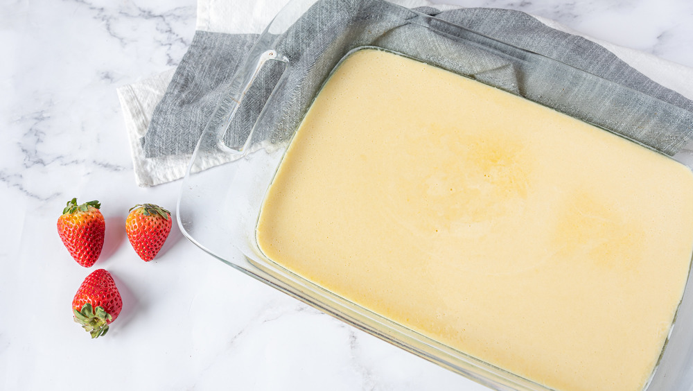 baking a cake for tres leches with strawberries