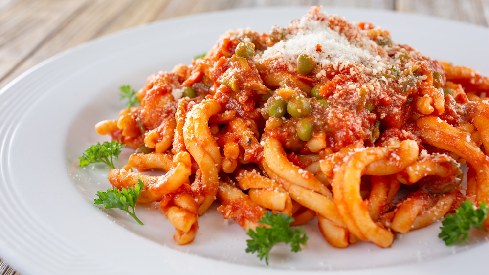 Strozzapreti primavera on a white plate 