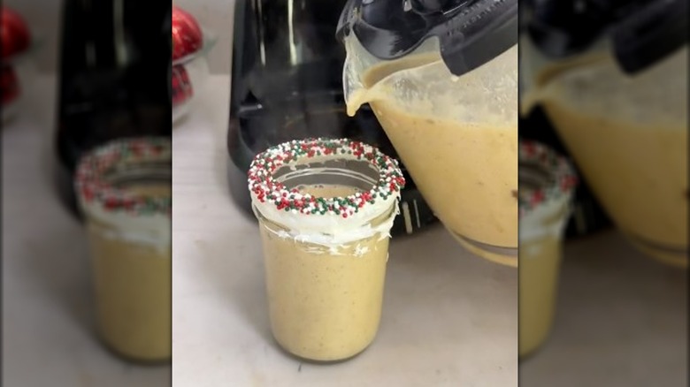 A glass of eggnog made using a coffee pot