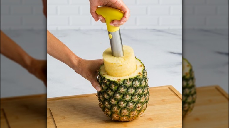 pineapple being cored