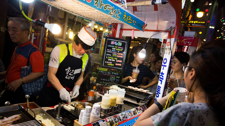 Food vendor in a food truck at a Korean night market