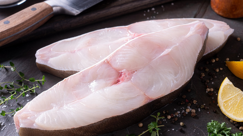 Halibut steaks on cutting board