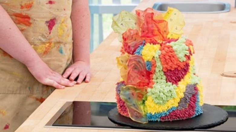 Multicolored cake on black tray