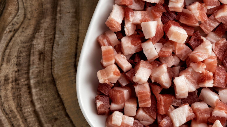 Cubes of bacon in a bowl