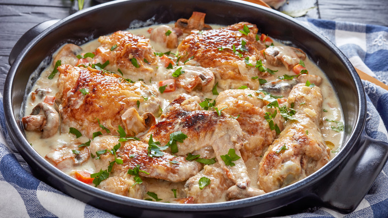 Chicken fricassee in cast iron skillet