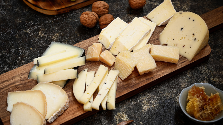 A board arranged with hard and soft cheeses 