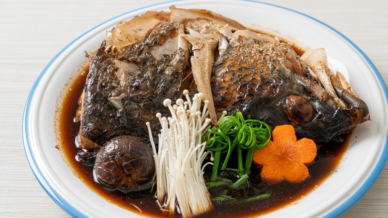 Fish head with soy sauce and vegetables