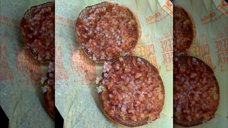 A McDonald's burger with only condiments and extra onions