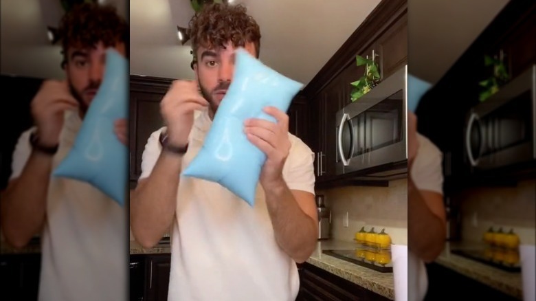 TikToker holding bagged milk