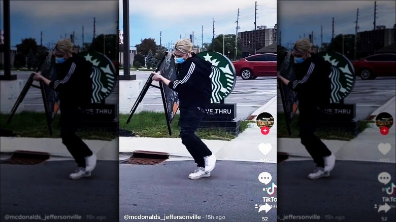 McDonald's employee stealing Starbucks sign