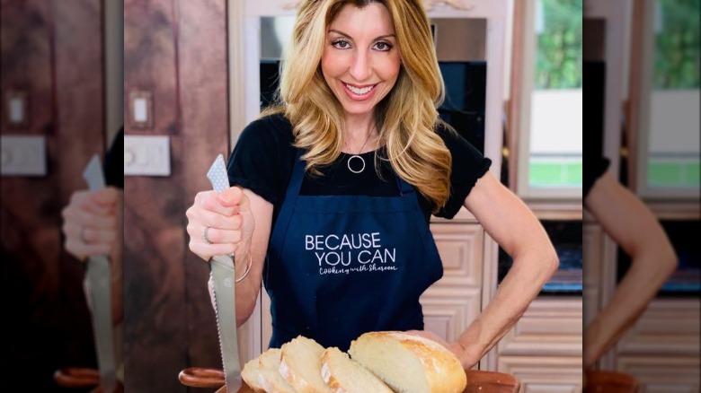 Shereen Pavlides in apron with knife