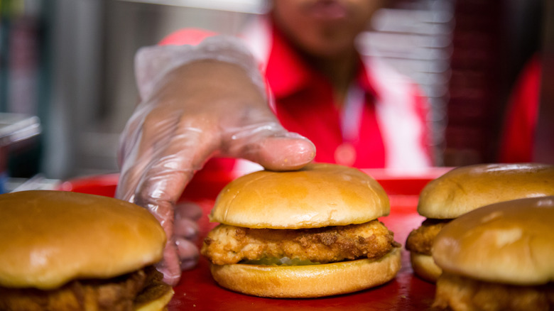 Employee picks up chicken sandwich