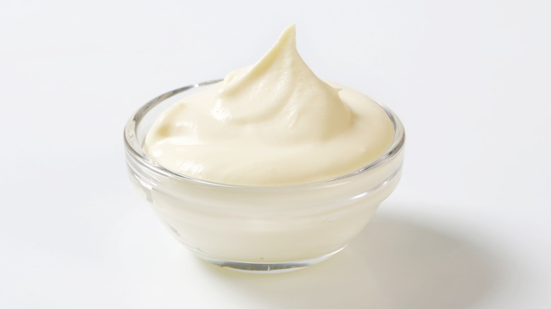 a glass bowl of sour cream