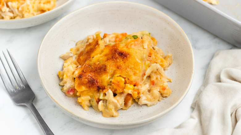 cheesy chicken cobbler in dish 