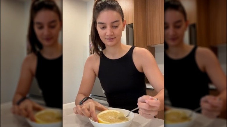 Emily Mariko eating a pomelo