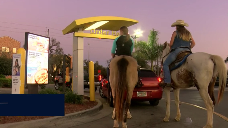 people on horseback in mcdonald's drive thru