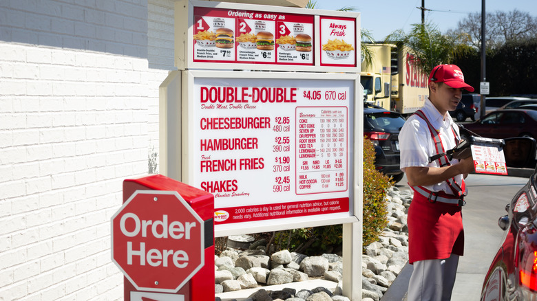 In-N-Out drive-thru with employee taking order