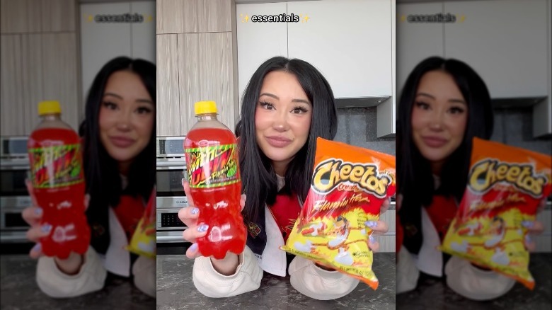 Ashley Yi holding Cheetos and Mountain Dew