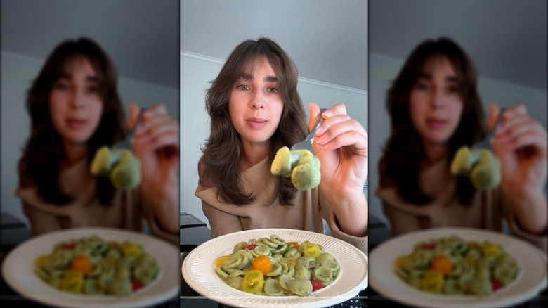 Woman with avocado pasta