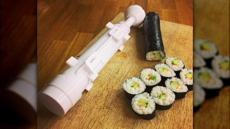https://www.mashed.com/img/gallery/tiktoks-viral-sushi-making-tool-is-a-convenient-alternative-to-bamboo-mats/what-on-earth-is-a-sushi-bazooka-1677196358.jpg