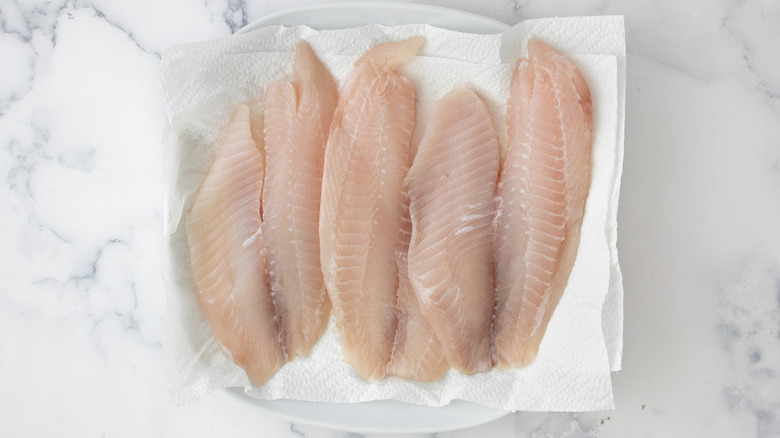 tilapia filets on paper towels