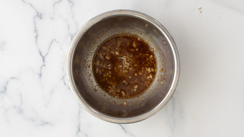 seasoned oil in metal bowl