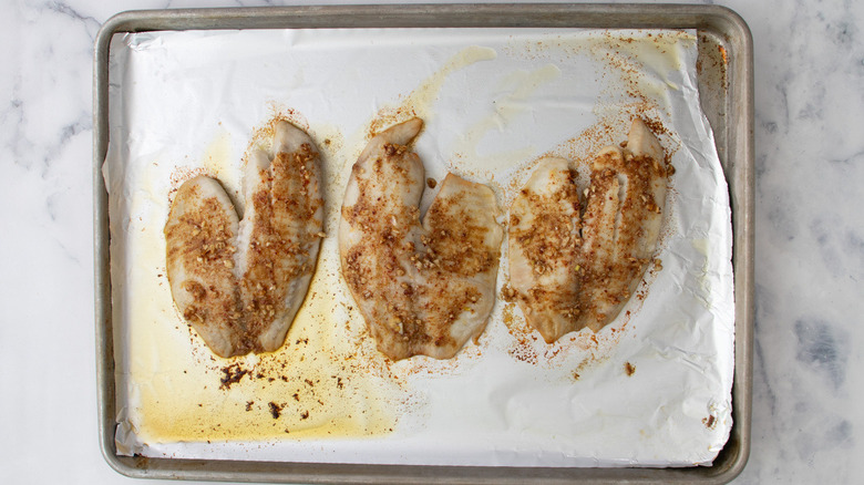 seasoned tilapia filets in pan