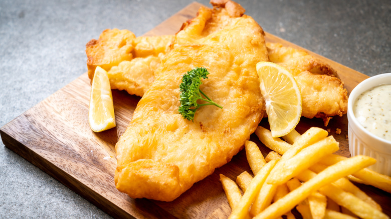 Fish and chips on wooden board